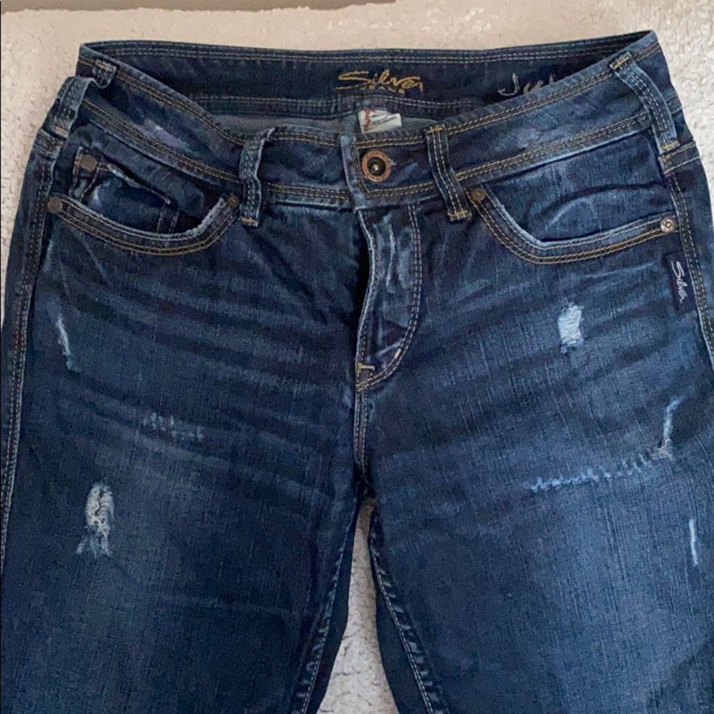 Silver destructed bootcut jeans